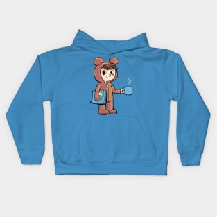 boy prepares for bed with a cup of warm milk and a picture book Kids Hoodie